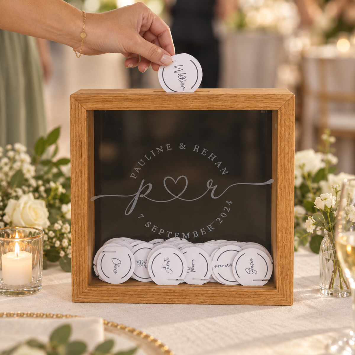 Personalised red oak memory shadow box used as a wedding guest book with a guest adding a round message card.