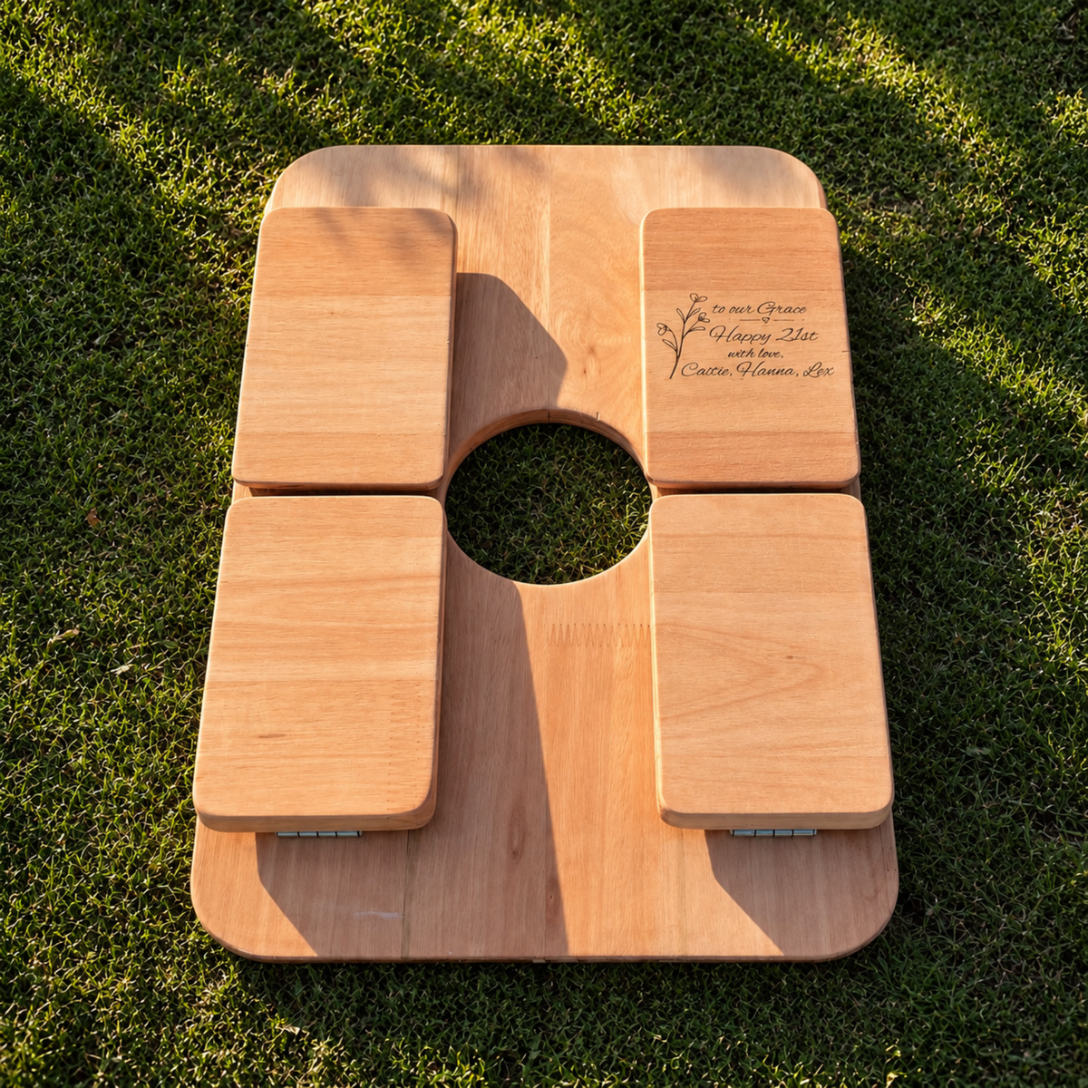 Personalised foldable picnic table shown folded flat for compact storage and transport.