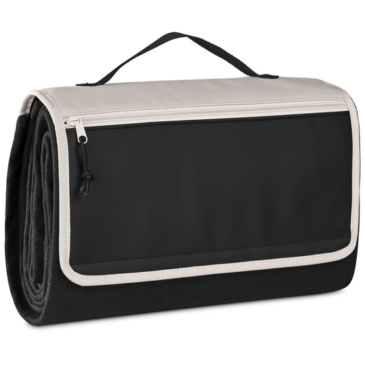 Large black picnic blanket folded into compact carry format with handle and zipped front pocket