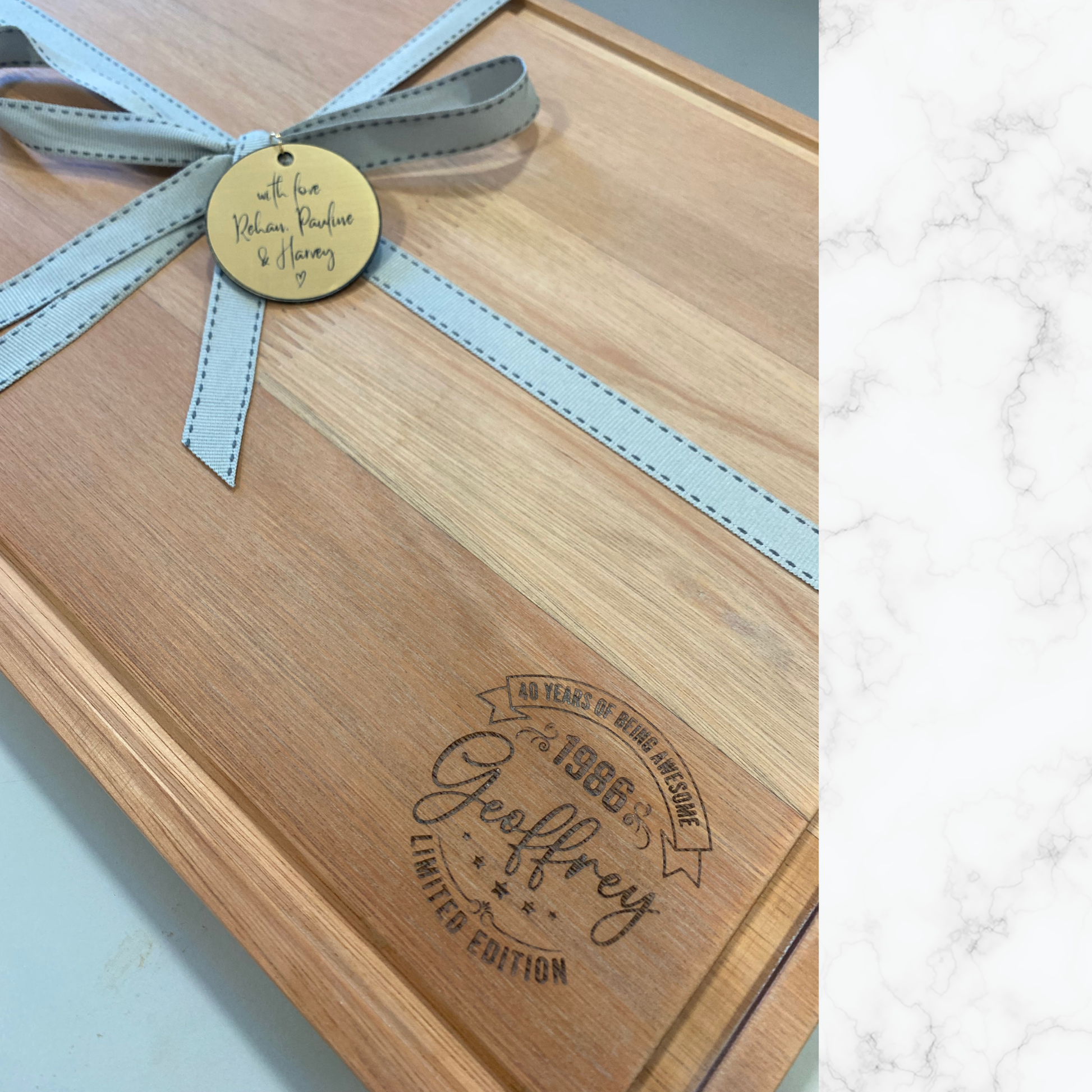 Close-up of custom 40th birthday engraving on a personalised wooden cheeseboard