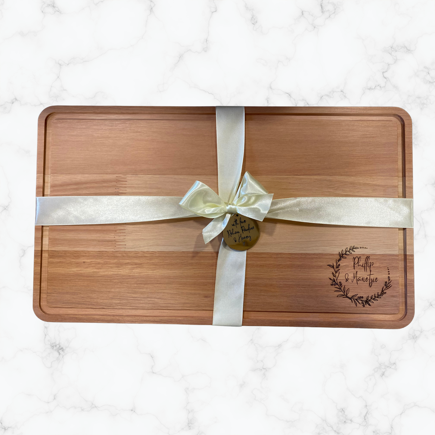 Personalised hardwood cheeseboard presented with satin ribbon and engraved gift tag