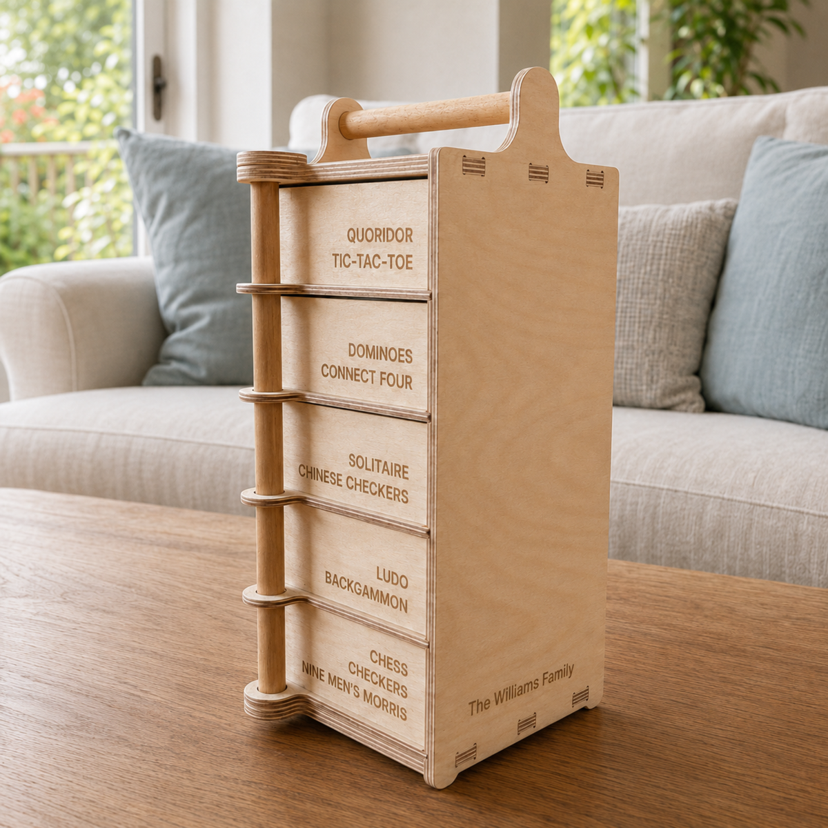 Side view of personalised wooden Games Tower showing five labelled storage drawers