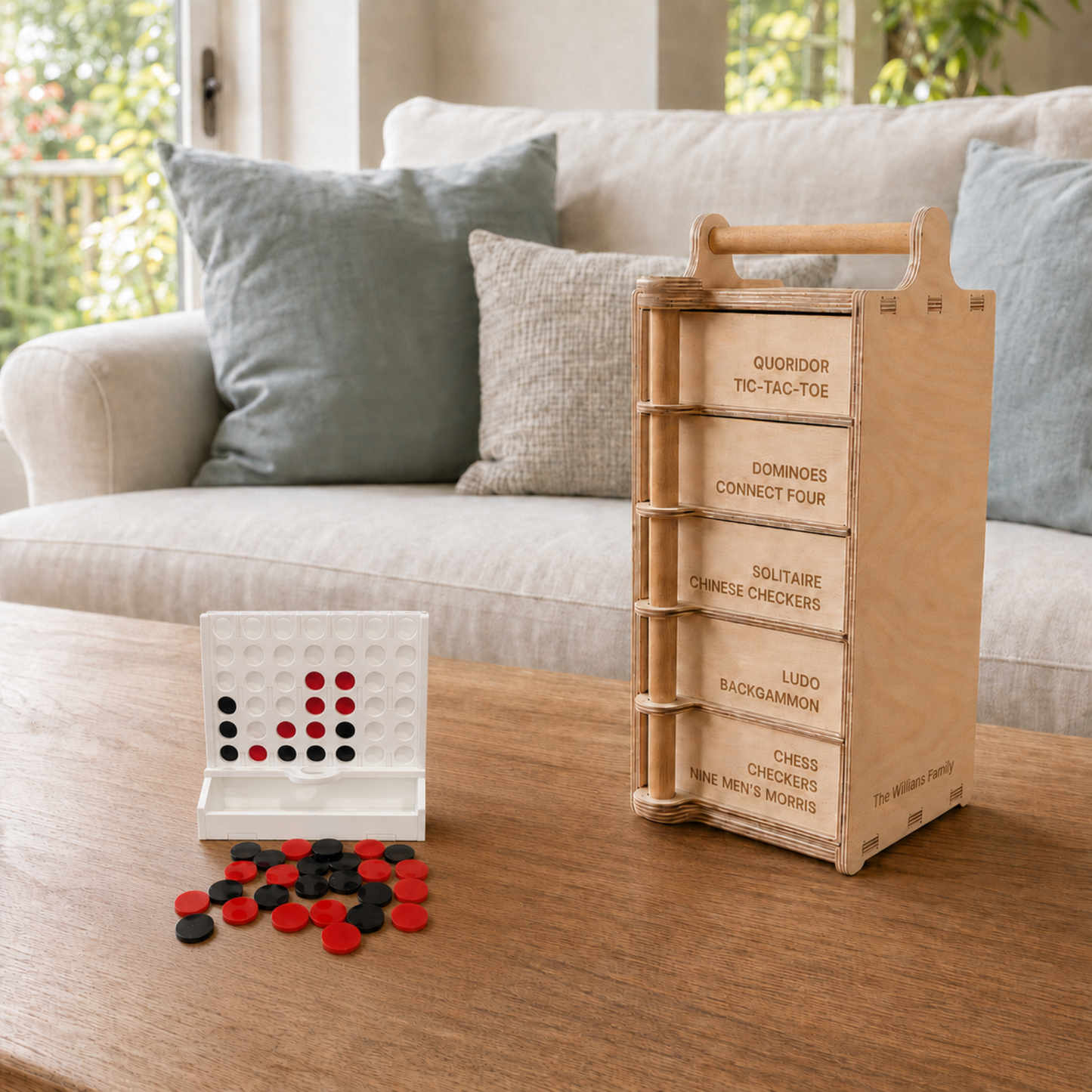 Four in a Row game with red and black counters beside the wooden Games Tower