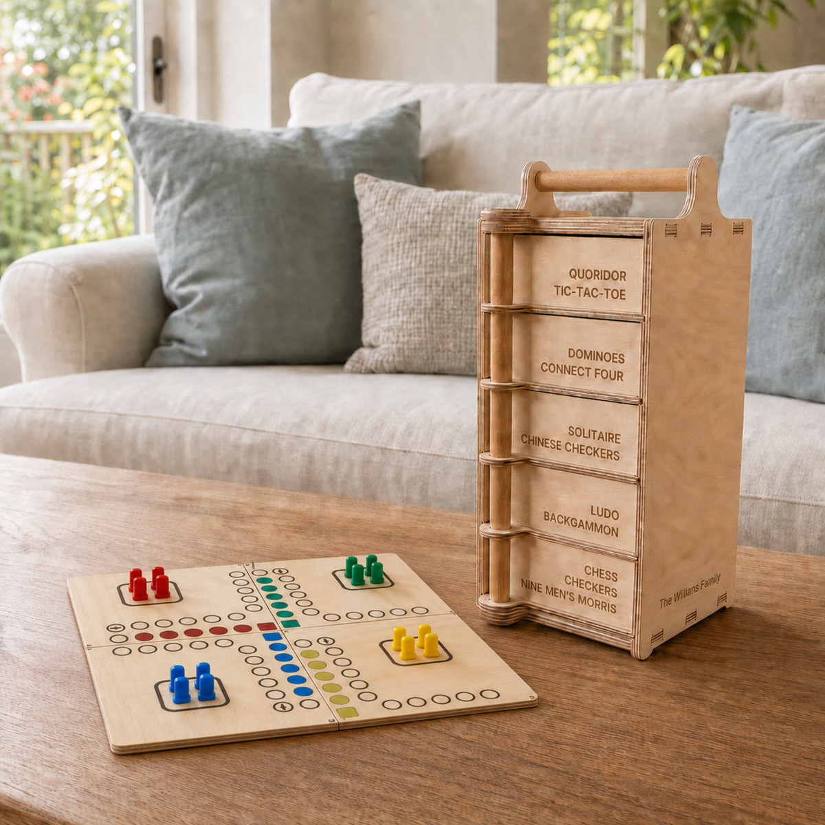 Wooden Ludo board with colourful playing pieces beside the Games Tower