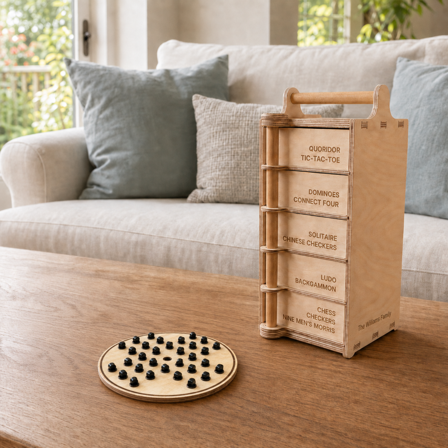 Round wooden Solitaire board with black playing pegs beside the Games Tower